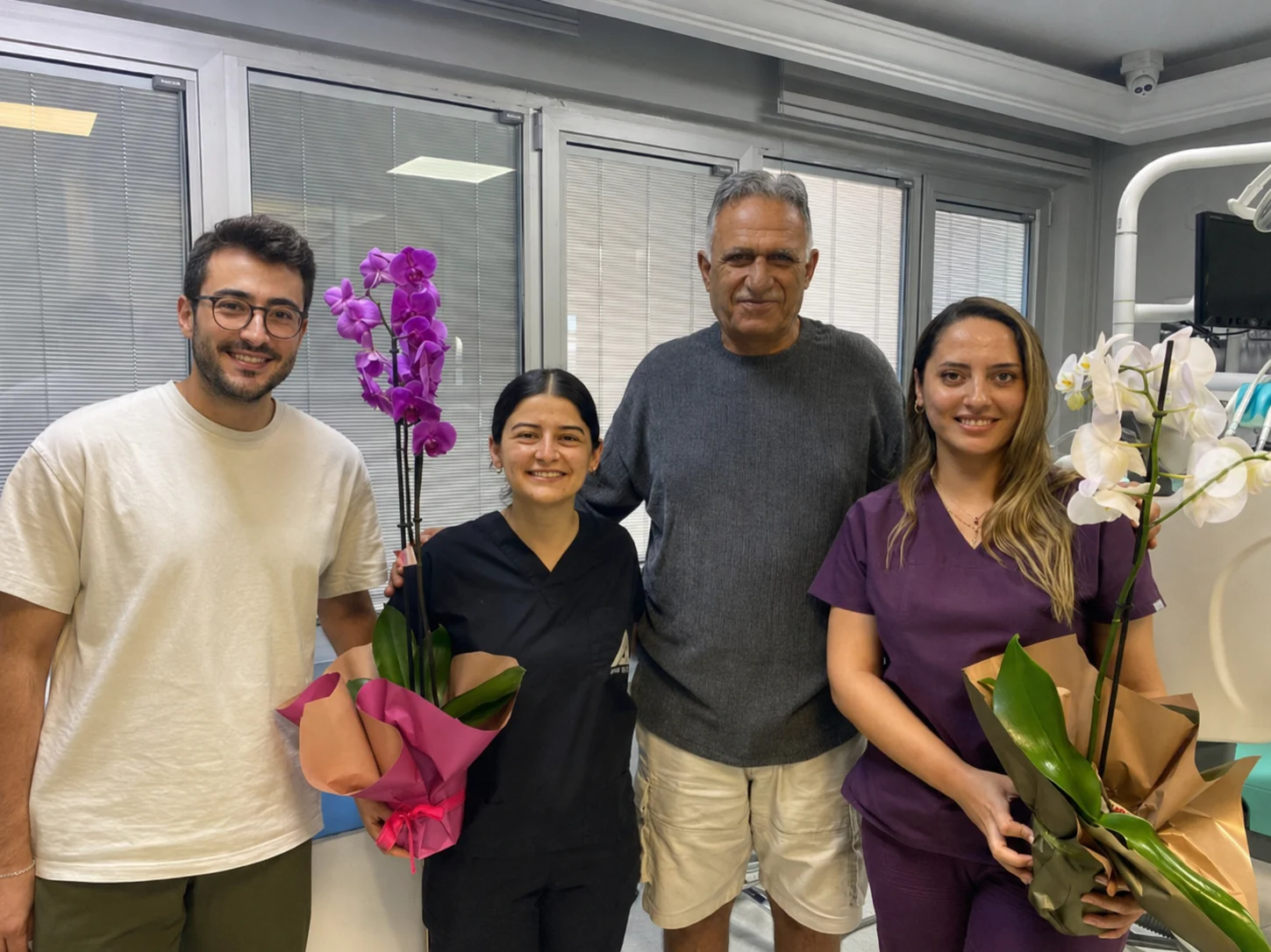 A TravelMedi patient with members of the care team